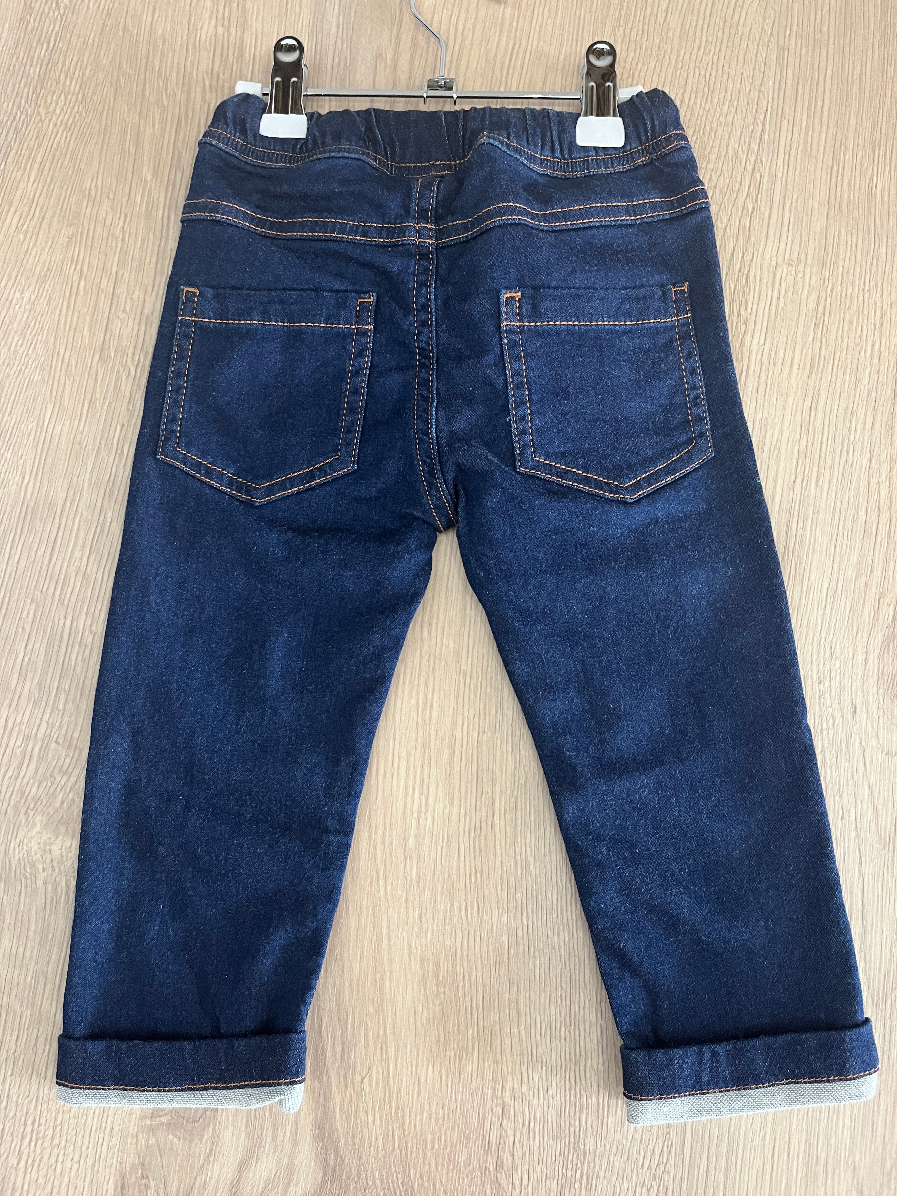 Jeansbroek met oranje details