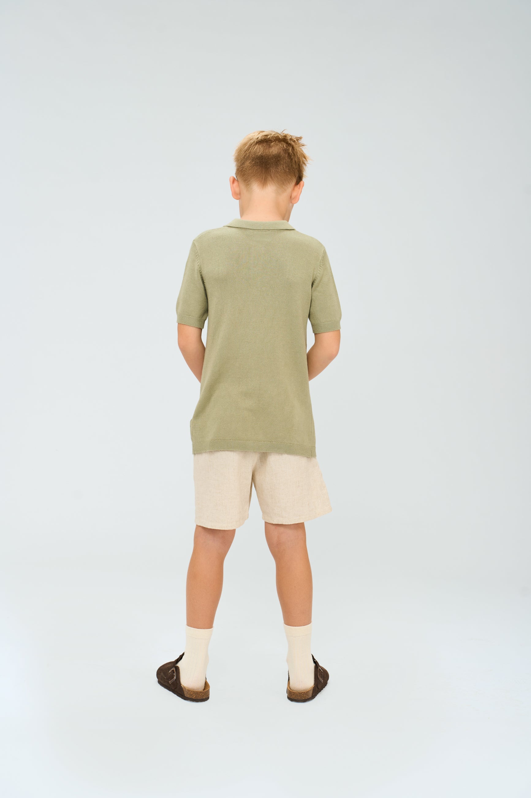 🌿 The New Orlando – gebreide polo in zacht groen