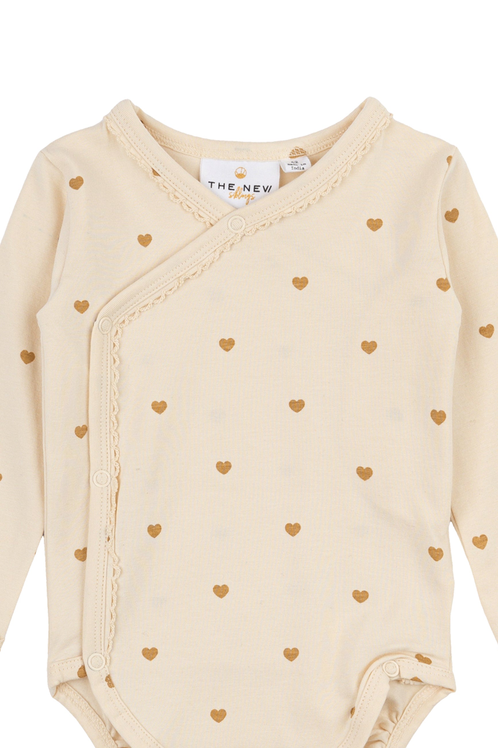 The New Siblings – Lange Mouwen Overslagbody – White Swan met Hartjesprint